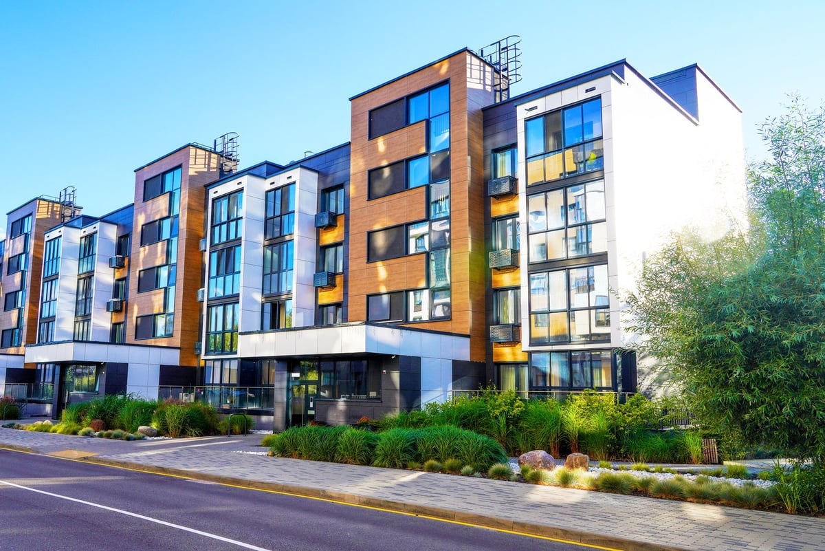 Modern apartment complex building representing multi-family residential properties